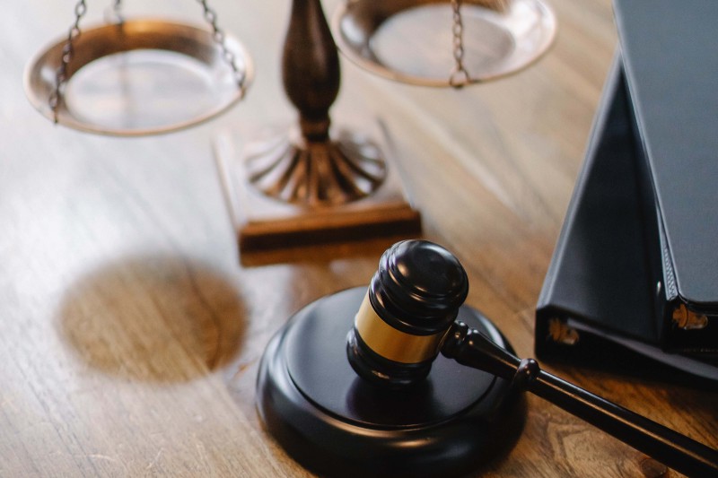 Scales and a gavel on a desk Scales and a gavel on a desk
