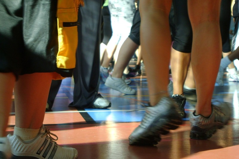 A low angle image of feet in trainers dancing