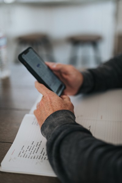 A person holding a smartphone with both hands