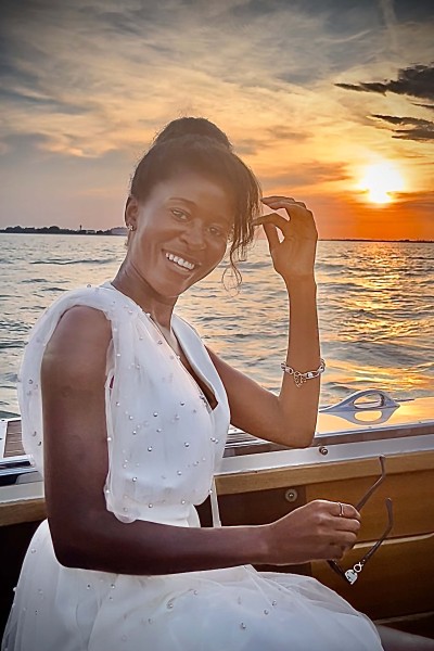 Nicola Matiwone on a yacht at sunset