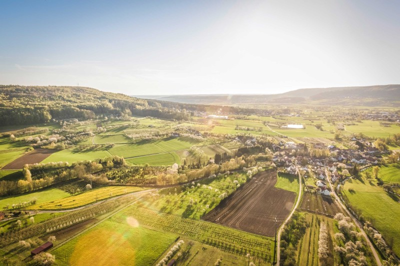 A rural landscape An aerial image of a rural landscape with fields and buildings