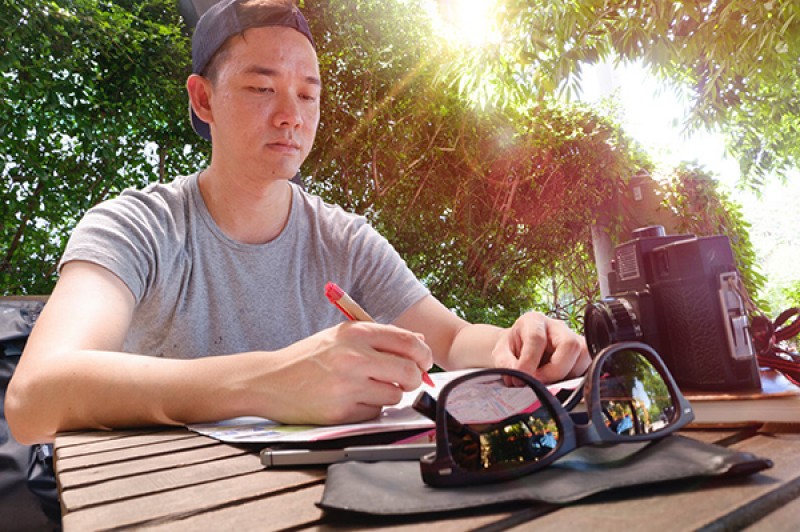 student writing outside student writing outside