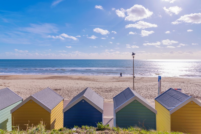 Beach huts on sunny Bournemouth beach