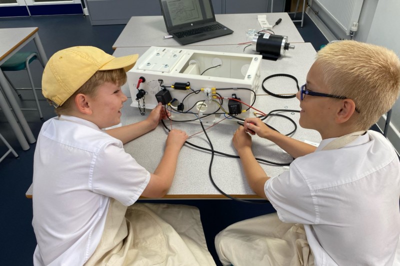 Pupils from St Peter's School work on an electric car